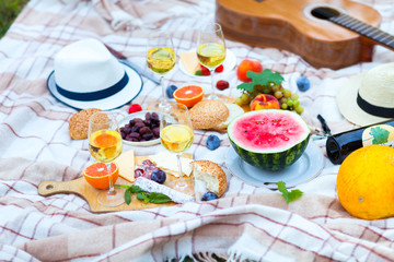 Summer Picnic Basket on the Green Grass. Food and drink concept. Friends Party time