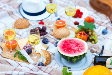 Summer Picnic Basket on the Green Grass. Food and drink concept. Friends Party time