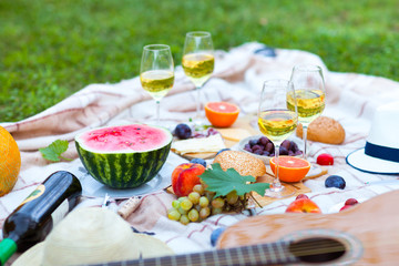 Summer Picnic Basket on the Green Grass. Food and drink concept. Friends Party time
