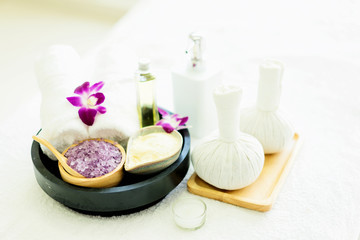 Fototapeta na wymiar Herbal ball spa.Spa massage treatment products for good health on the white table.Close up spa body theme.spa ball