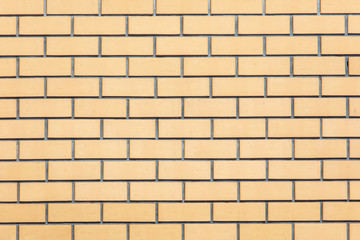 Yellow bricks in the wall as an abstract background