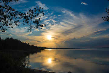 Fototapeta na wymiar Reflection sunset in the lake