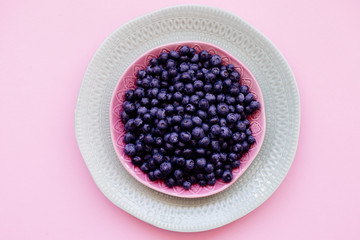 Blueberry berries in a plate.