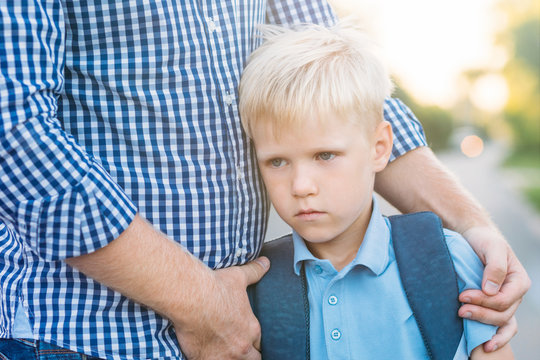 Father Supporting His Upset Son. Back To School Concept.