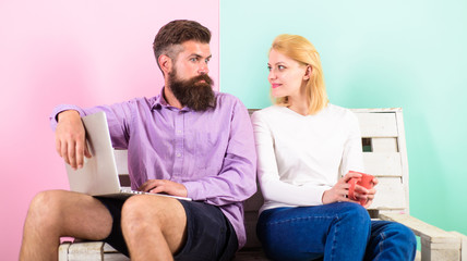 Couple with laptop going to watch movie. Family spend leisure together. Couple choosing movie and have opposite opinion. What we going to watch. Find compromise. Couple different opinion about movie