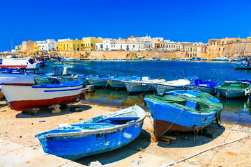 Traditional Italy. Old port of Gallipoli, view with castle amd boats, Puglia.