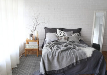 Fototapeta na wymiar comfort interior bedroom bed gray color