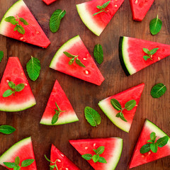 Watermelon slice pattern. Fresh watermelon on rustic wood background. Flat lay. Summertime concept..