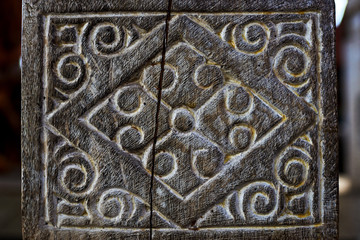 Detail of a wooden carved.  Old and vintage wooden part decorative panel. Handcrafted beautiful wooden carved.  Wooden pattern for decor. Intricate  wood crafted design. Abstract background.