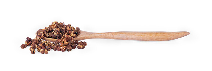 Dry Zanthozylum limonella Alston in wooden spoon on white background.