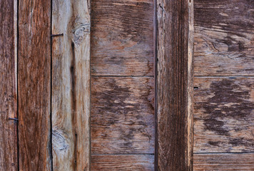 Surface eroded by time. Old cracked lumber texture and background. Abstract background, empty template. Weathered wood, natural scratch texture. Use as natural background. Texture of old barn wood.