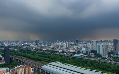 Fototapeta na wymiar scenic of rainy sky with cityscape building and train railway