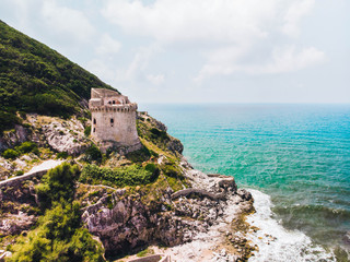 Beautiful scene, old building. Ancient defense tower on mountain in the Mediterranean sea. Paola...