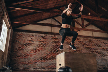 Fototapeta na wymiar Box jumping workout at gym