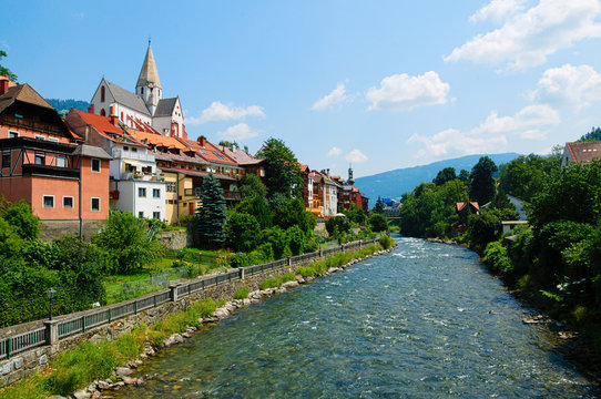 Beautiful city of Murau, Tyrol, Austria, Europe, with river, houses and church