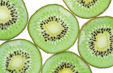 Close-up of kiwi slices isolated on white background.