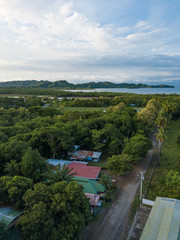Obraz premium Rural Farms and the green lush jungle around Paquera Costa Rica captured via Drone