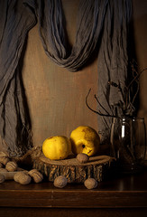 Quince, apples, pears on a wooden cut.