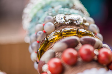 Gemstone bracelets and necklaces in a row. Jewelry made of heliotrope stone, swarovski crystals, moonstone and sugilite blue stone. Healing, powerful crystal energy. Esoteric and colorful background
