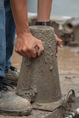 Obraz premium Concrete slump test before pouring a foundation in construction site