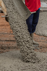 Pouring concrete in construction site