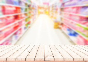 Wood table or wood floor with supermarket blur background for Product display