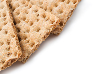 Slices of crunchy crispbread isolated on white background.