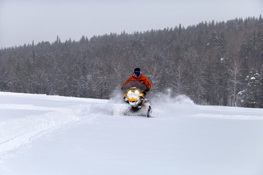 Athlete on a snowmobile