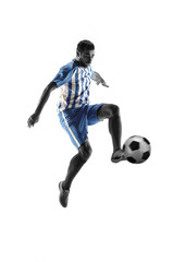 Plakat Professional football soccer player with ball isolated on white studio background