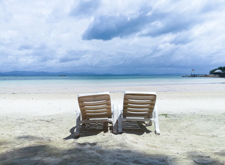 white plastic chair in the beach, Koh Talu beautiful island, Tropical Holiday, Thailand.