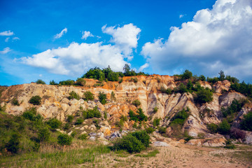 Eroded limestone rock hill with landslides