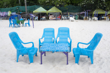 white plastic chair in the beautiful beach and white sand in holiday, Hua Hin, Thailand.