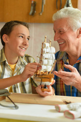 Portrait of a boy with model of plane