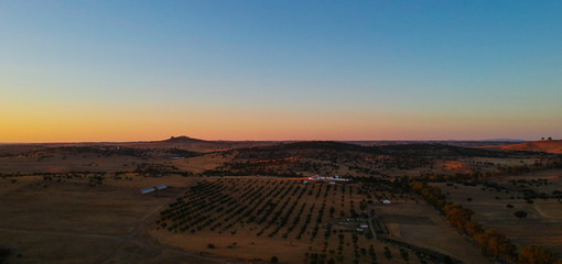 Aerial view from landscape with fields and a lake at the sunset. Drone photo