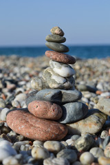 Fototapeta na wymiar Colorful sea pebbles - Beautiful round stones on the beach