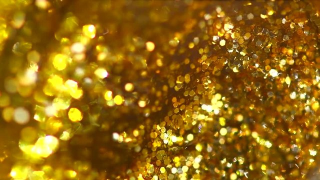 Golden sparkles background. Gold пlitter вust backdrop. Holiday bokeh. 3840X2160 4K UHD video footage