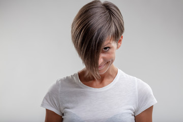 Cute woman peeking out from under her fringe