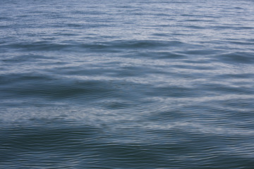 Clean smooth ripples in the deep blue sea. The gulf of Thailand. 