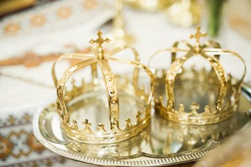 Golden crowns lying on the table in church