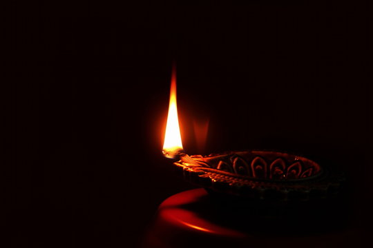 diya lamp for  indian hindu religious concept background for ganesh puja  diwali new year or pongal greeting