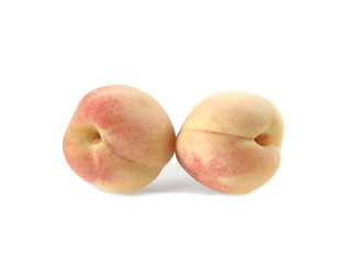 two sweet ripe peach fruits on white background