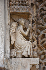 Italy, Puglia region, Altamura,  Cathedral of Santa Maria Assunta, gate and sculptures of the main façade.
