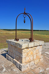 Obraz premium Italy, Puglia region, view and detail in the high Murgia area with wells, trees, meadows,