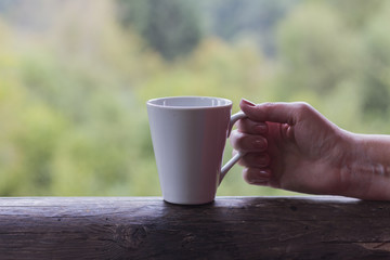 Obraz premium Elderly woman with cup of tea