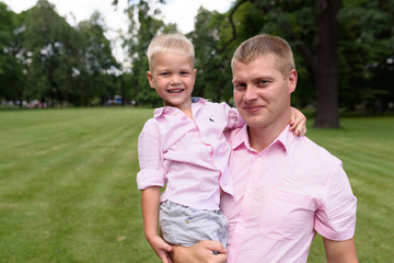 Fototapeta premium father and son in park