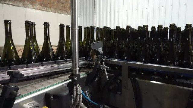 Bottling and sealing conveyor line at winery factory
