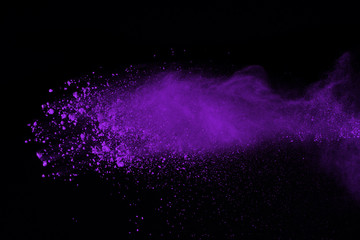 Abstract purple powder explosion on black background. abstract colored powder splatted, Freeze...