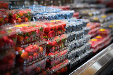selection of berries in grocery store