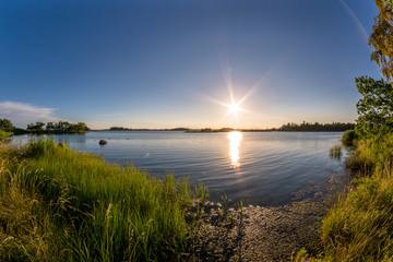 Beautiful sunset at a green ocean coast © DZiegler
