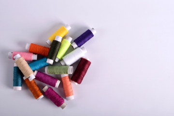  tools for sewing, needles, bobbin, scissors.Copyspace frame with sewing tools and accesories on...